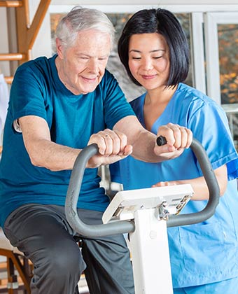 Caregiver Assisting in Workout